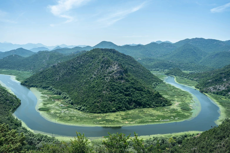 view from above of a river surrounded by mountains