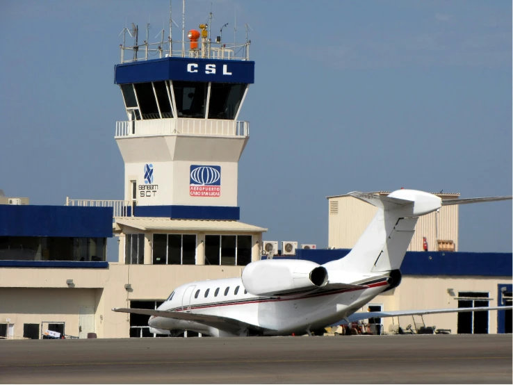 an airplane is sitting on the tarmac at an airport