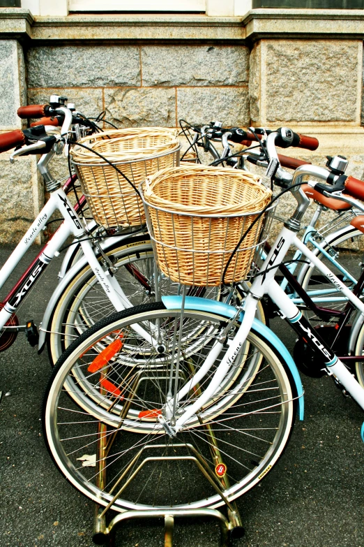 several bikes parked next to each other on the sidewalk