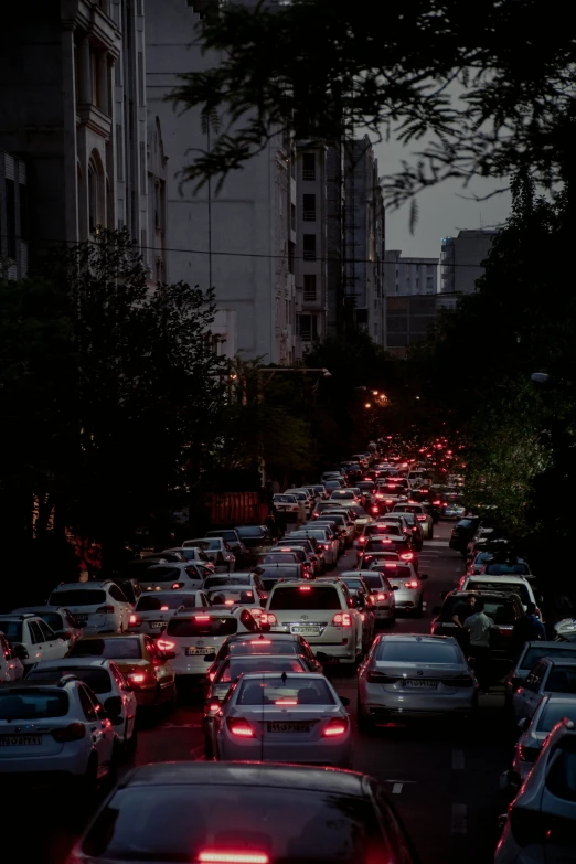 a line of parked cars in a city street