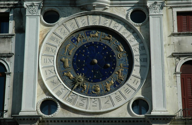 a large clock face mounted on the side of a building