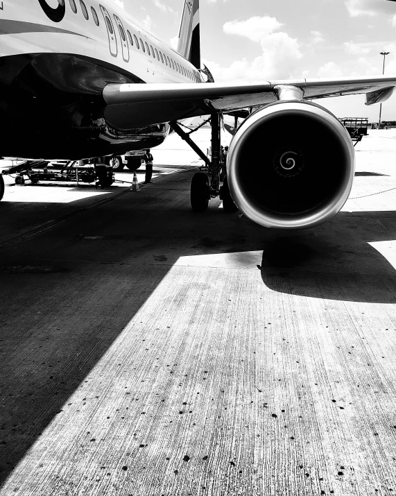 front side view of airplane sitting on the tarmac