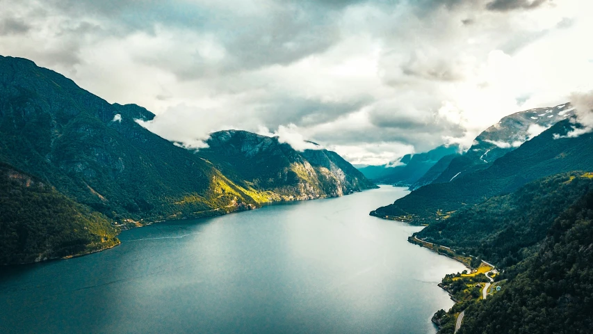 a view of some very pretty water surrounded by mountains