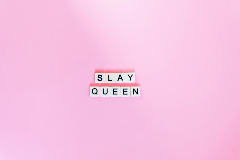 a scrawny word placed on a wall with the words slay queen