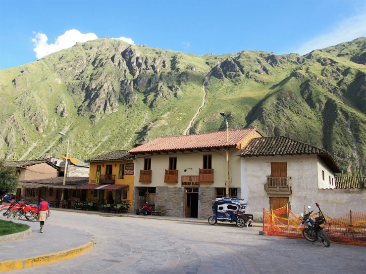 a mountain view with an open air market