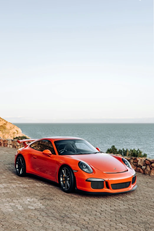 a car parked next to a rocky beach