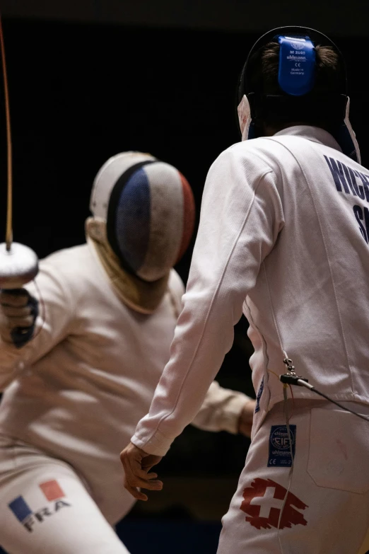 fencing with helmets and equipment in motion