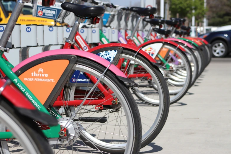 a row of colorful bicycles parked next to each other