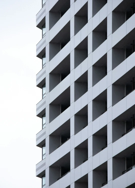 a tall building is made up with balconies