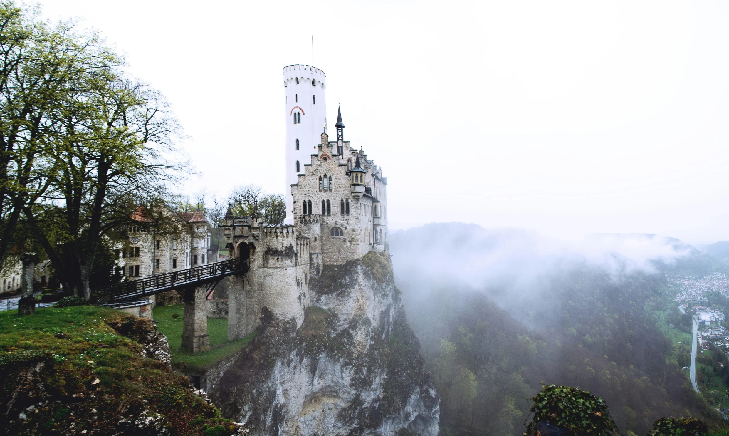 a big castle sitting in the middle of a field