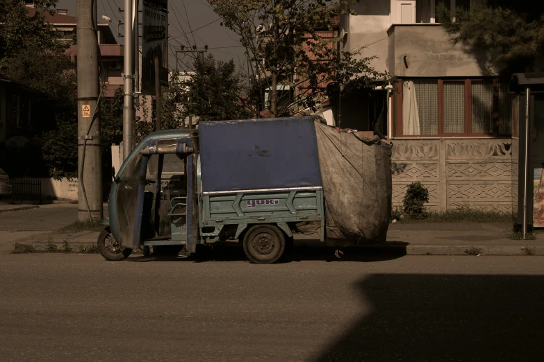 there is a garbage truck sitting on the street