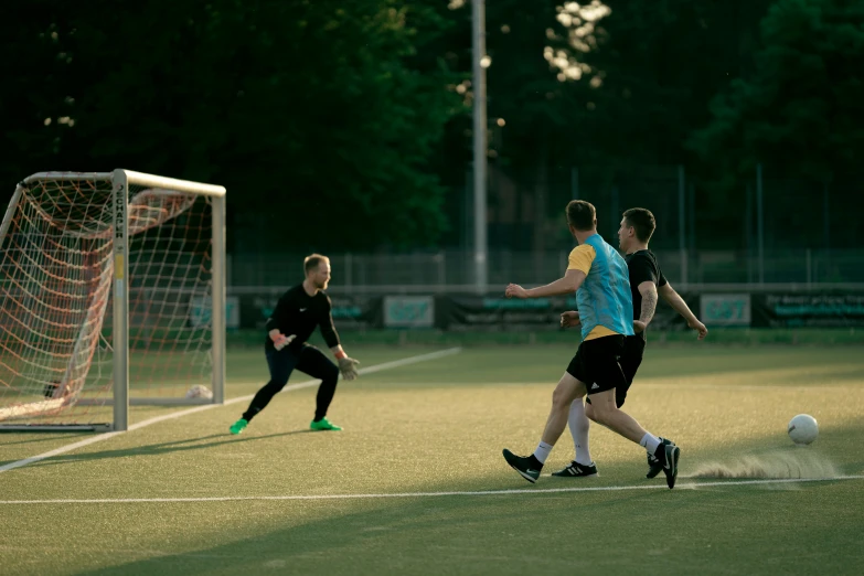 two soccer teams are running on a field