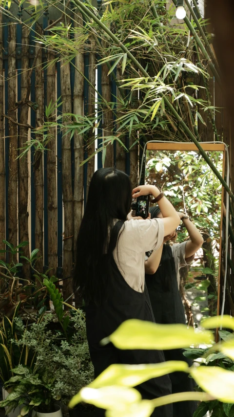 a woman takes a picture of herself in a mirror