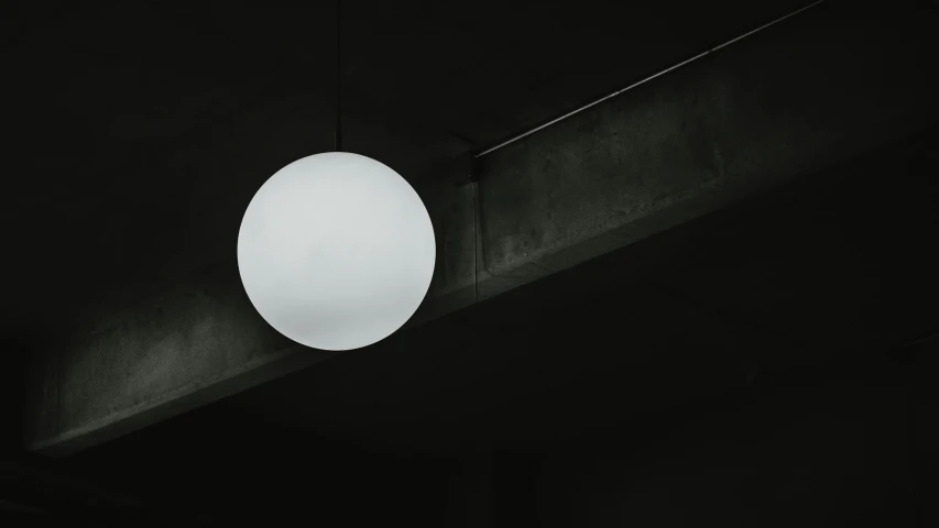 a circular light is hanging from the ceiling