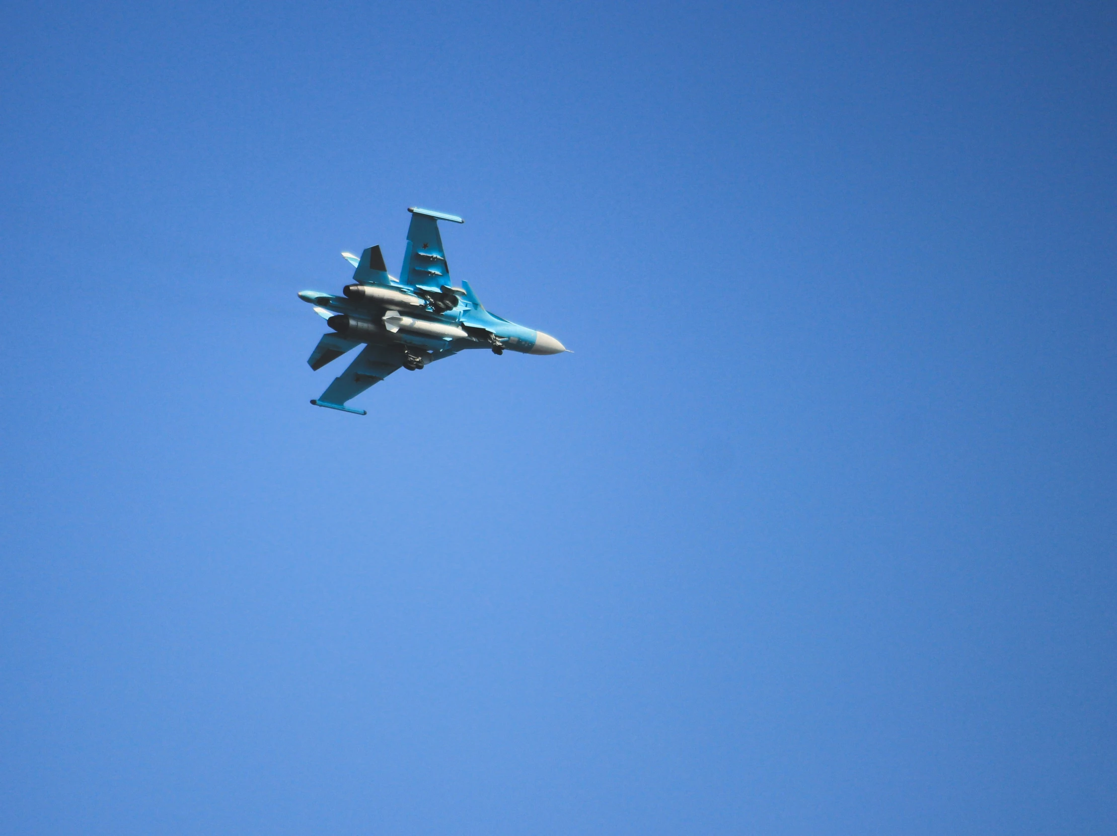 a fighter jet flies in the sky and appears to be landing