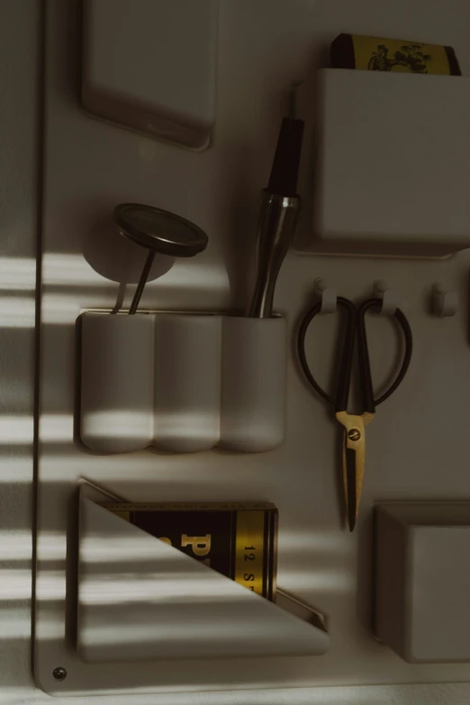 a pair of scissors sitting on a shelf