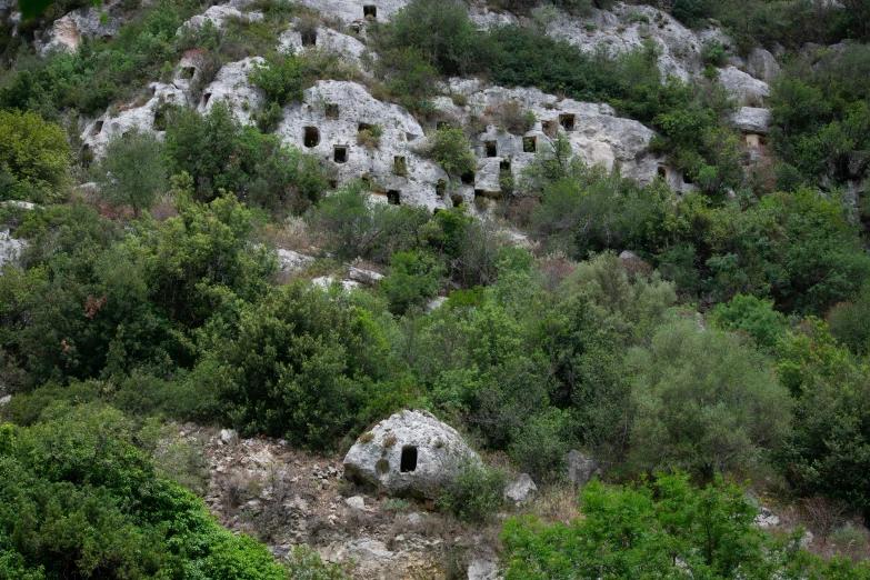 a huge hill with many small holes in the rocks