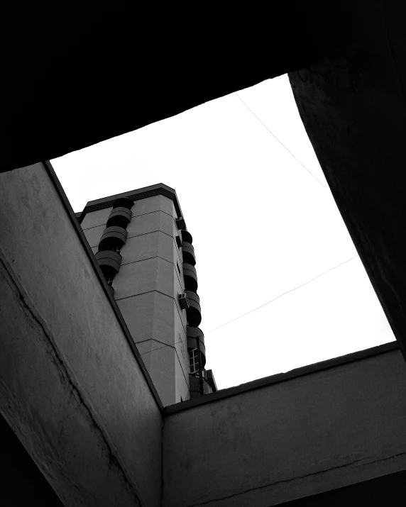 view from below, looking up at the sky with wispy clouds