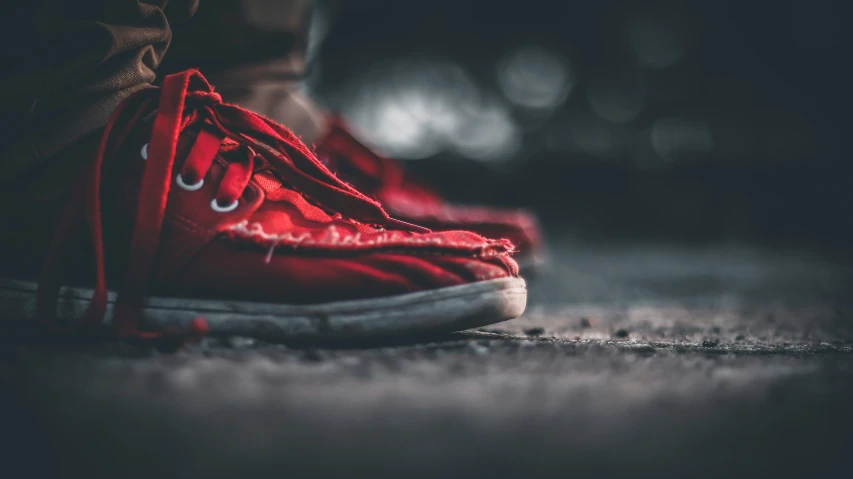 a closeup of a person's shoes on the floor