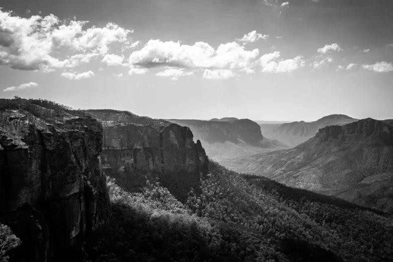 black and white pograph of mountains in a canyon