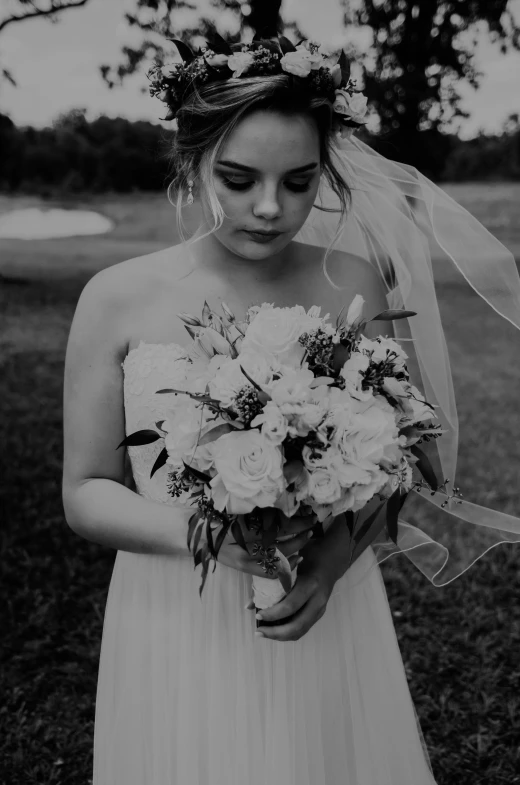 black and white po of bride in wedding dress