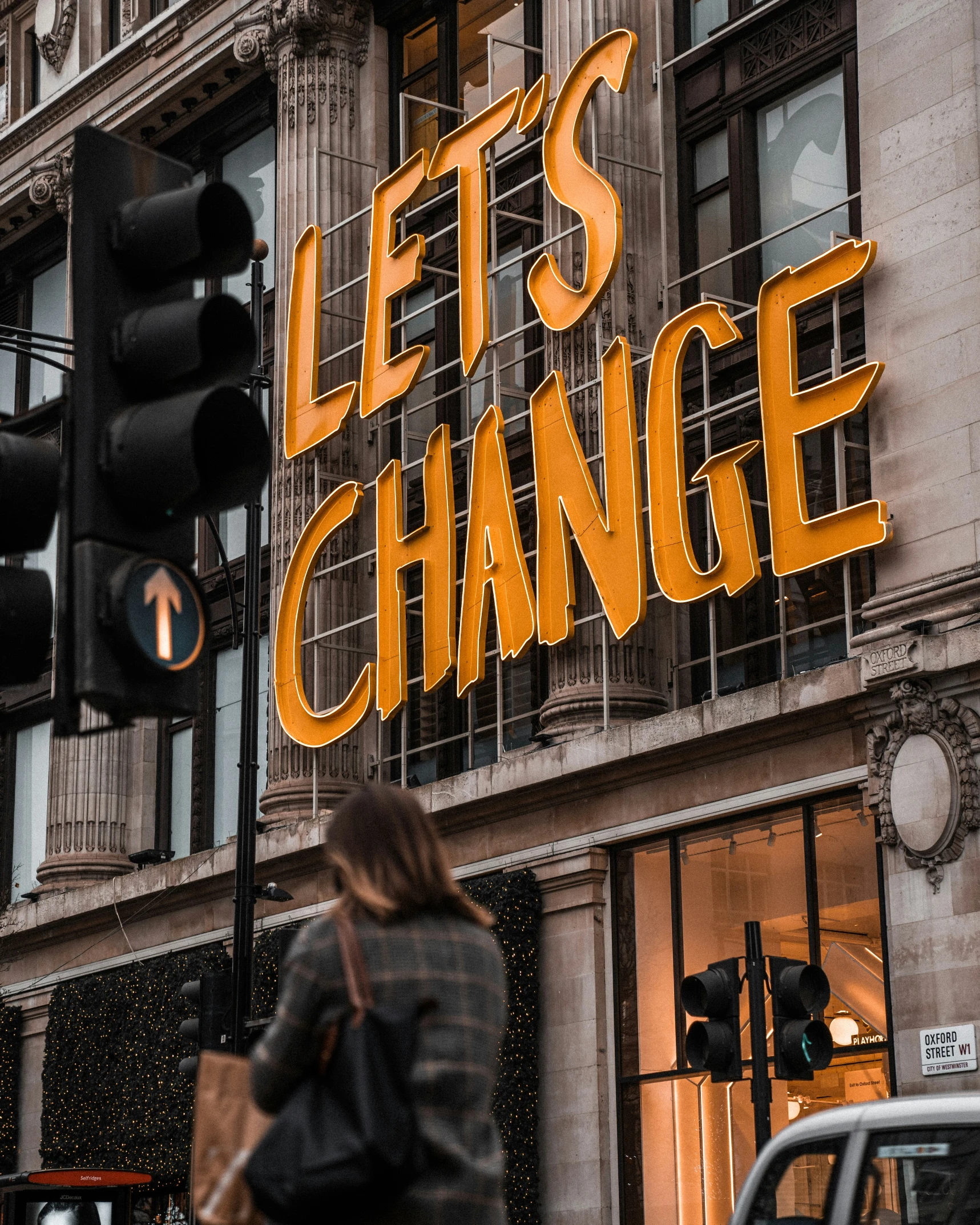 the sign for let's change on the side of a building