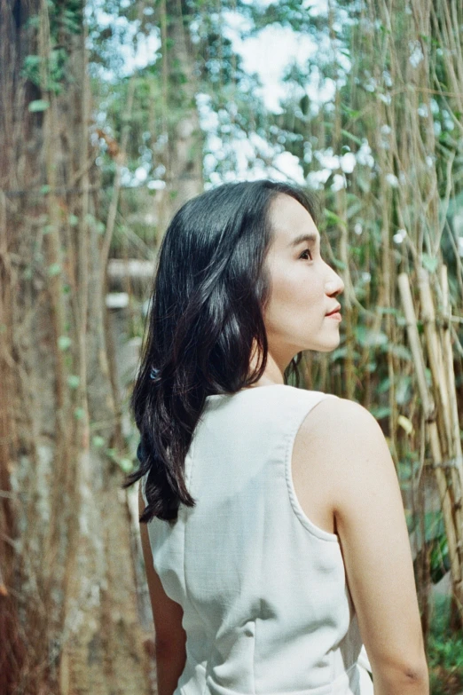 an image of a woman standing in the woods