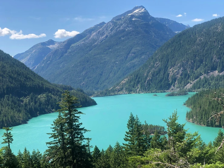 a river surrounded by mountains in the mountains