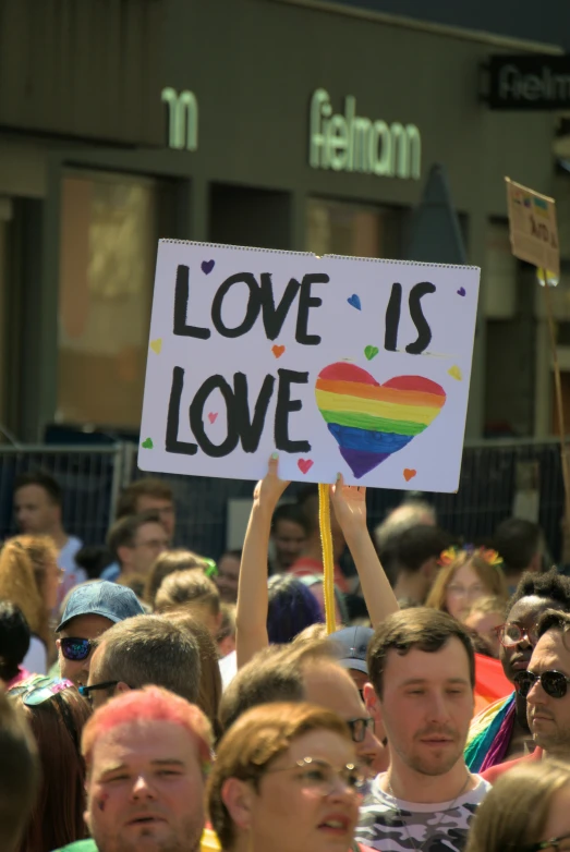 a bunch of people holding signs while at an event