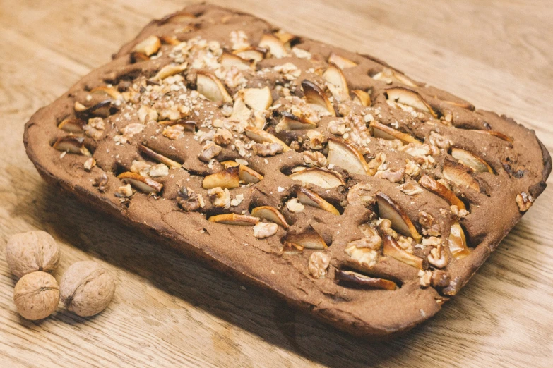 a wooden table with some brownies on it