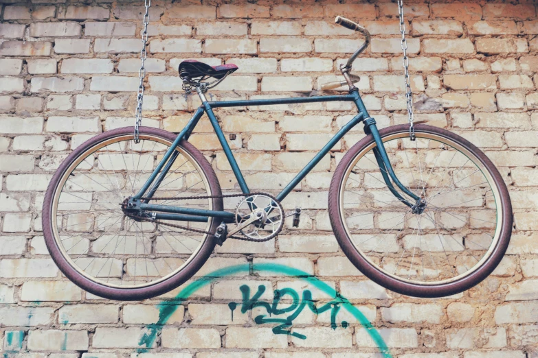 a bicycle that is suspended on a chain