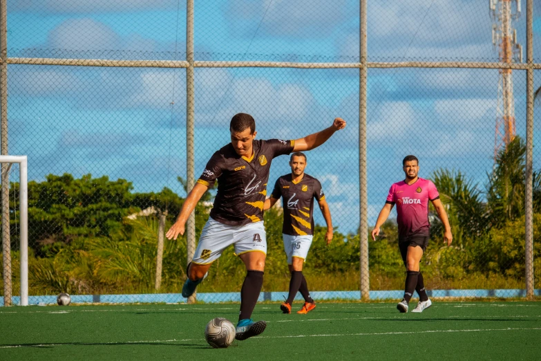 the soccer players are going for the ball