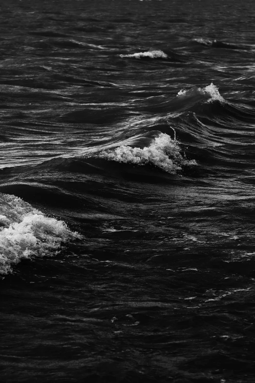 two surfers are riding the waves near each other