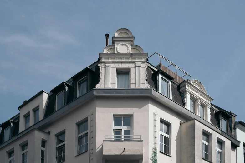 a white building with lots of windows and a clock tower