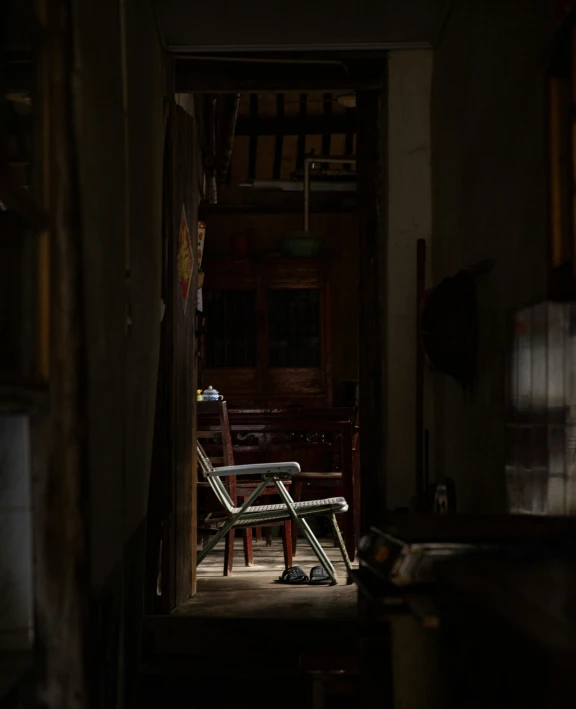 a couple of chairs sit at the end of a hallway