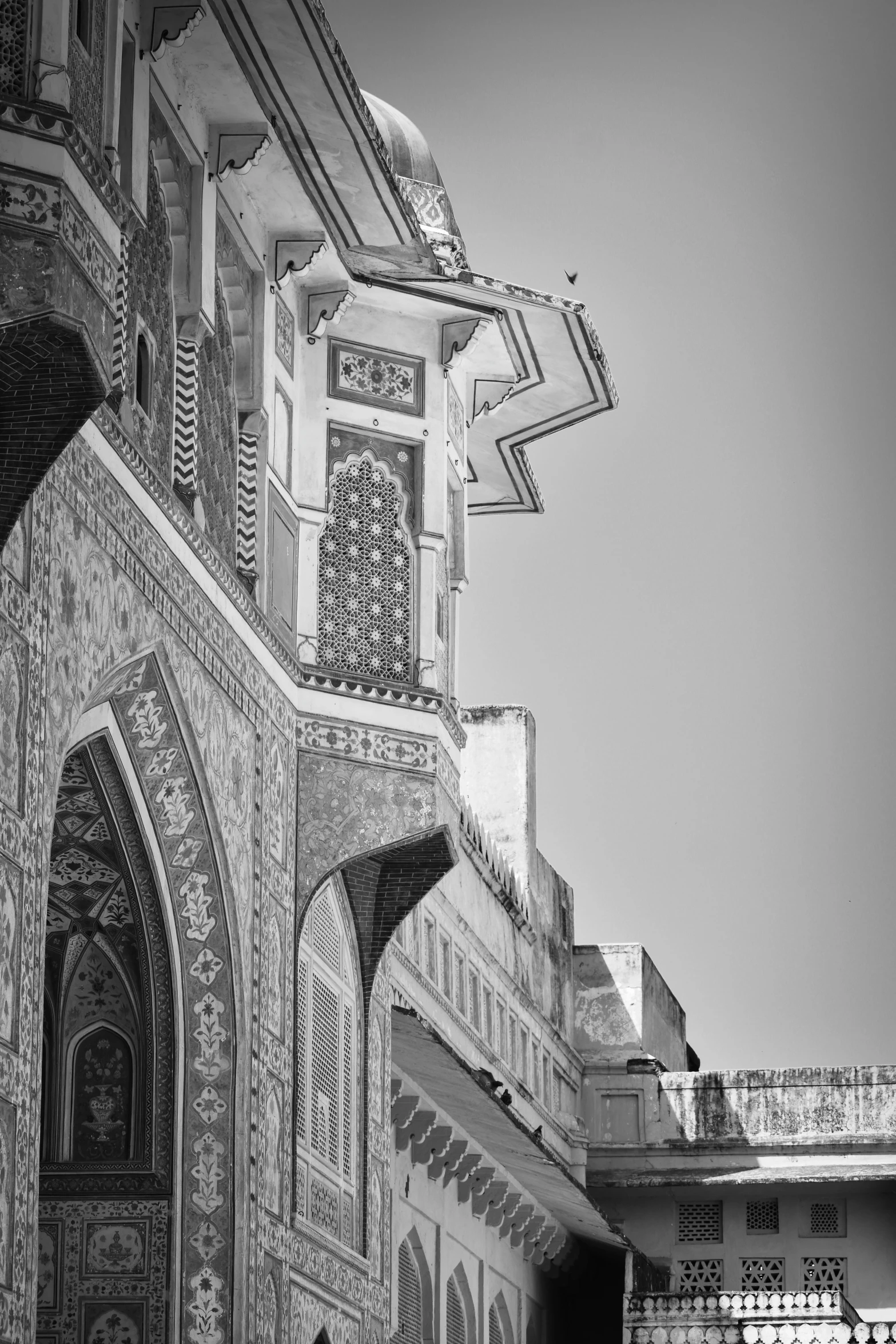 a large building has ornate design on the outside and front