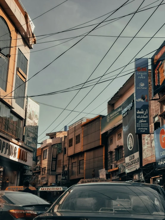 a car driving down the road in front of buildings