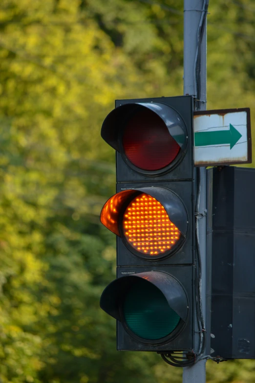 the traffic light is giving red on a crosswalk