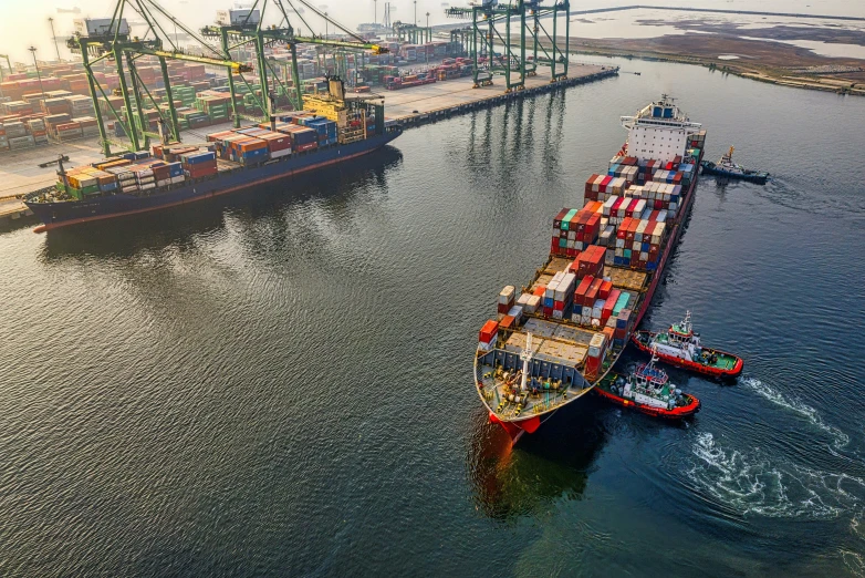 an aerial view of a large container ship docked at a dock