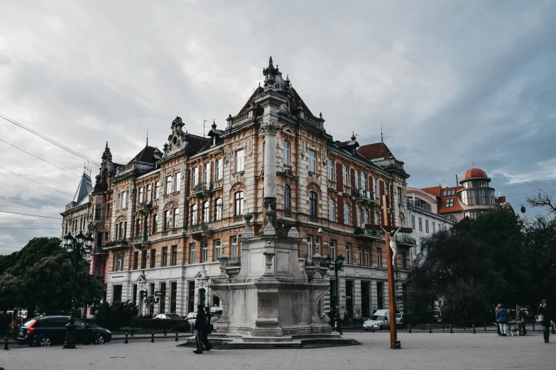 an old building sitting on a street corner