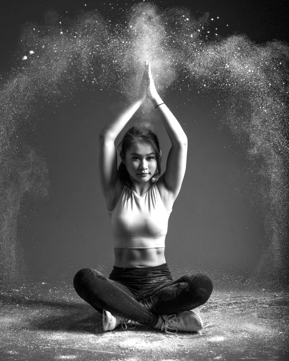 a black and white po of a woman doing yoga