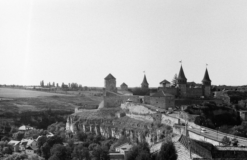 a view of a town with spires and roofs