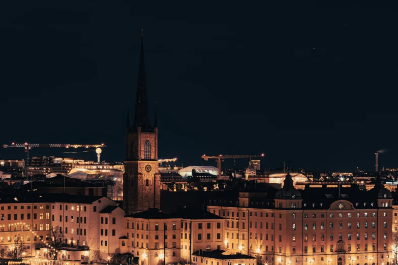 a view of some buildings on a city night