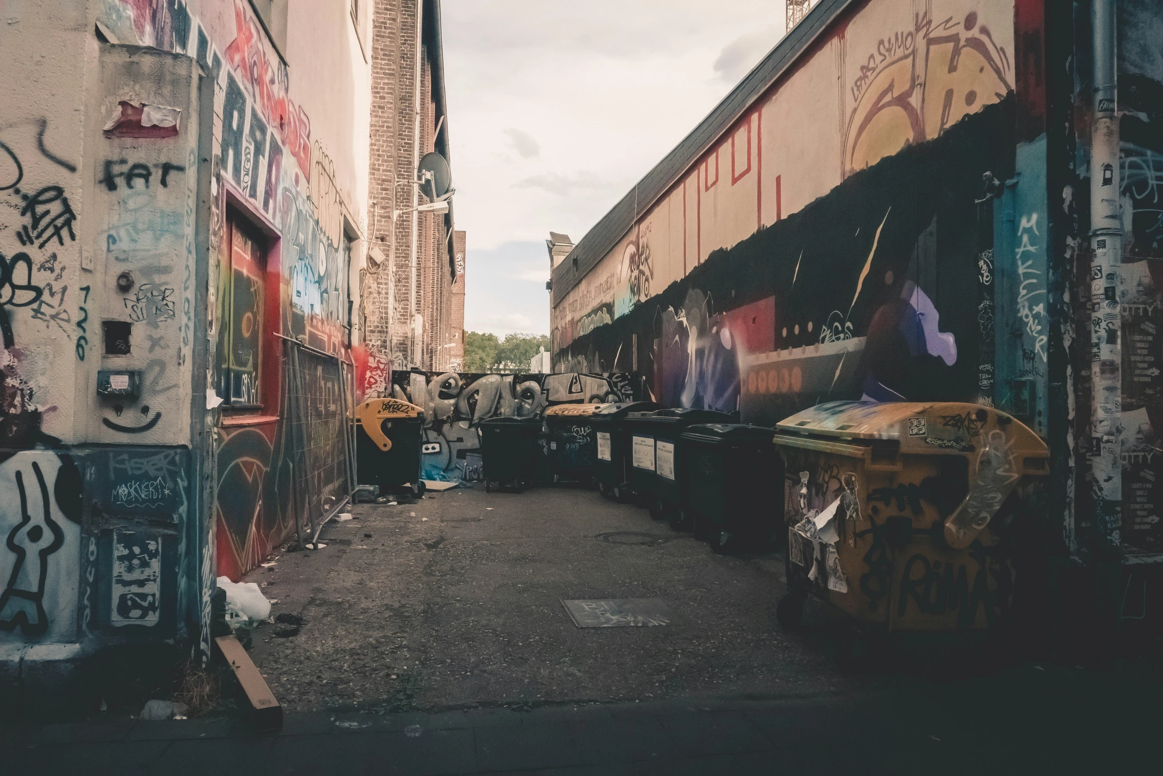 some buildings and one man has spray paint on it