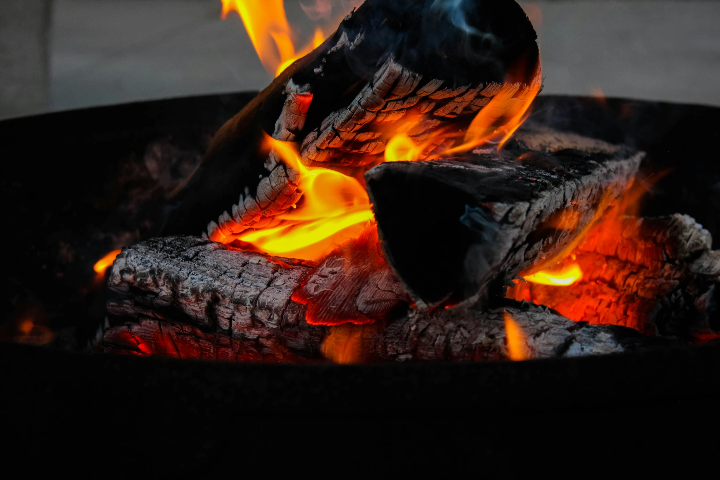 the flames inside of an open fire pit