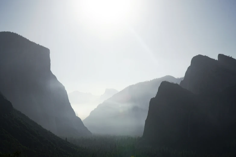 a mountain with some very tall cliffs in the background