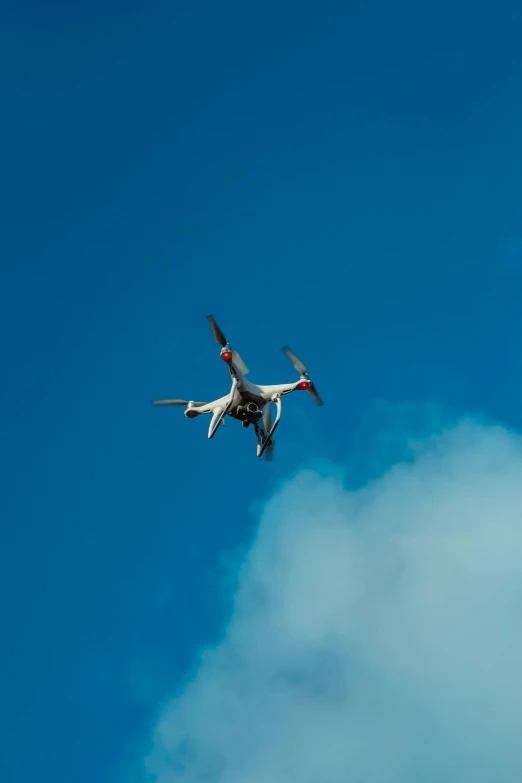 the underside of an airplane flying high up in the sky