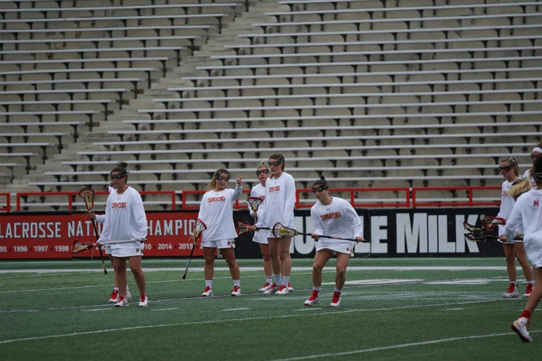 the players are standing on the field with their tennis rackets in hand