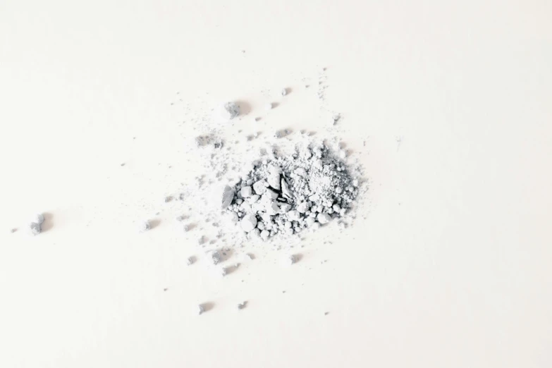 a powdered mixture of various materials on a white surface