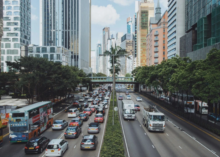 the busy highway is crowded with many vehicles